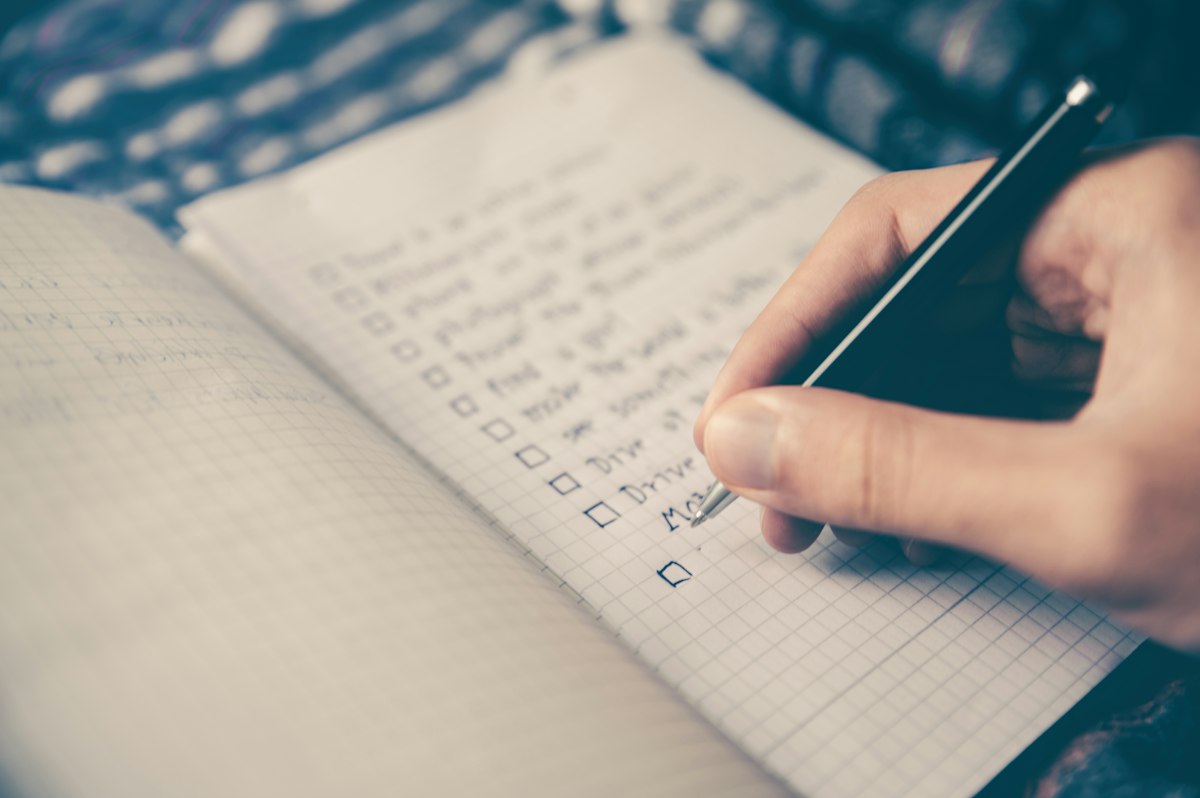 Notebook and pen on a desk for writing career action items
